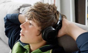 Teen boy using headphones