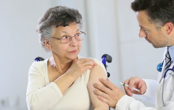 Physician treats elderly patient
